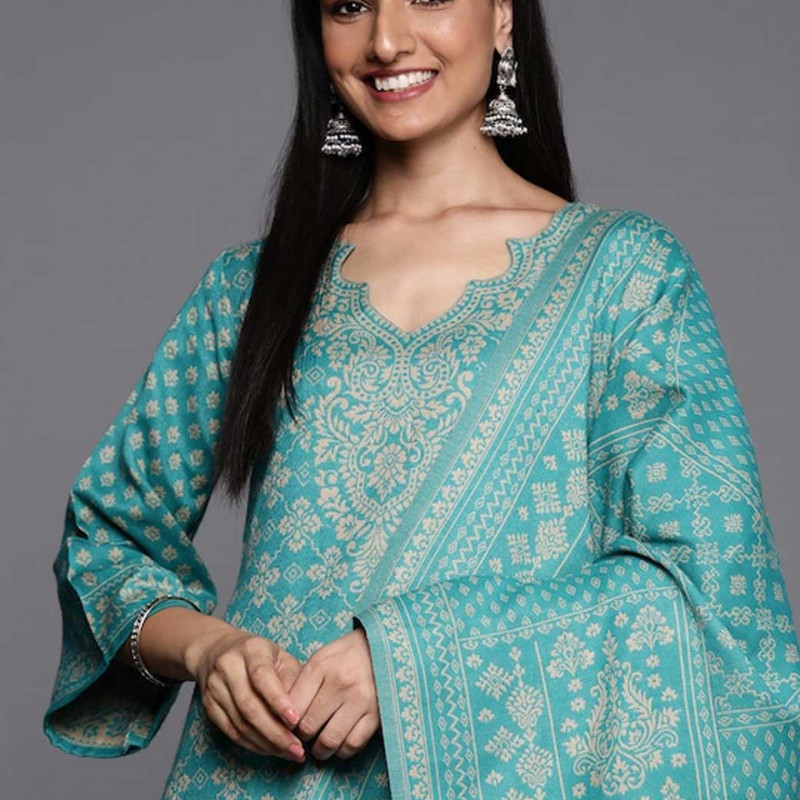 Green and beige woven design dress material