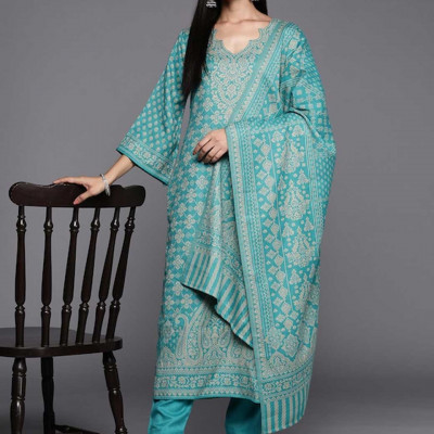 Green and beige woven design dress material